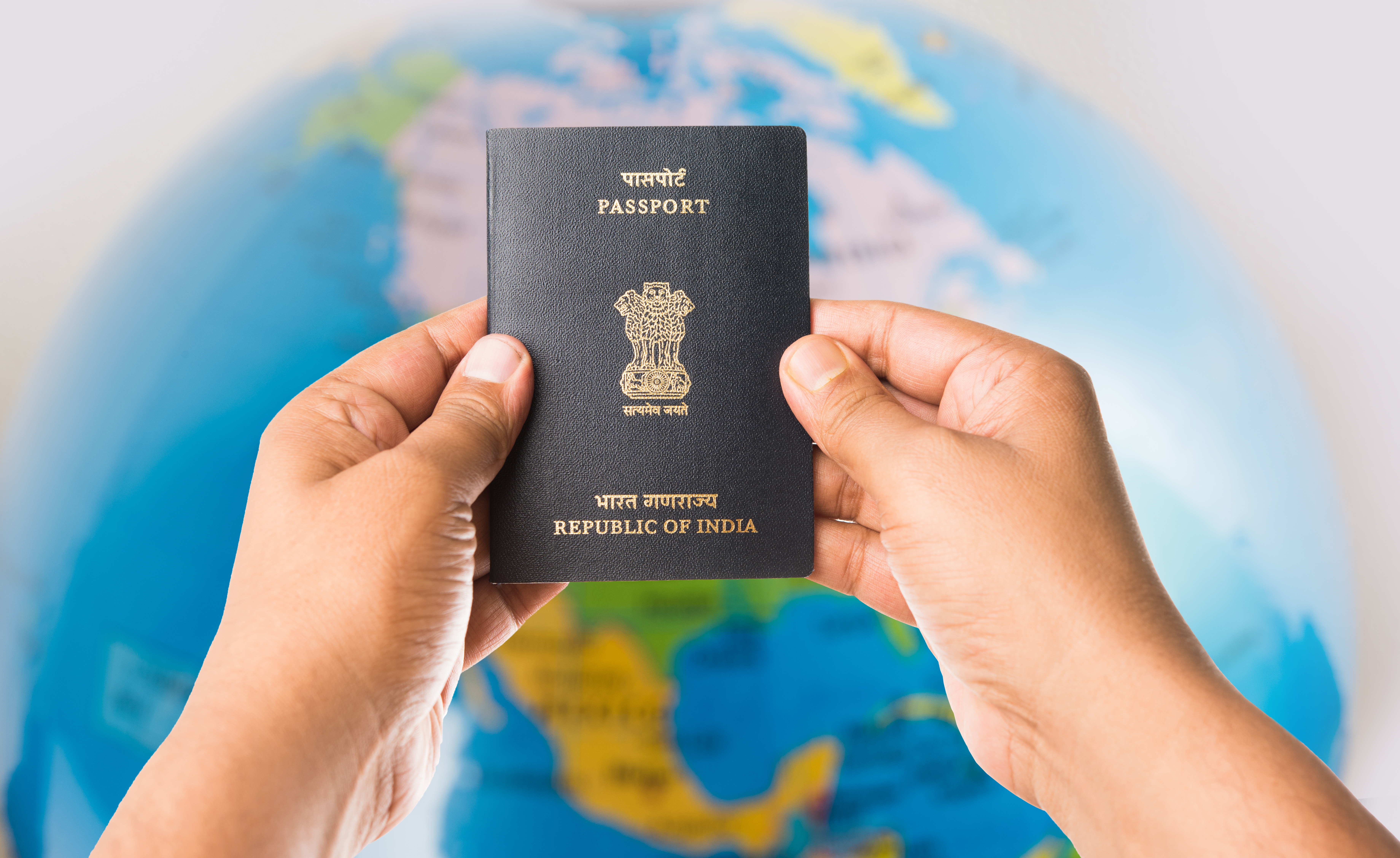Traveloite consultant helping a client prepare passport documents